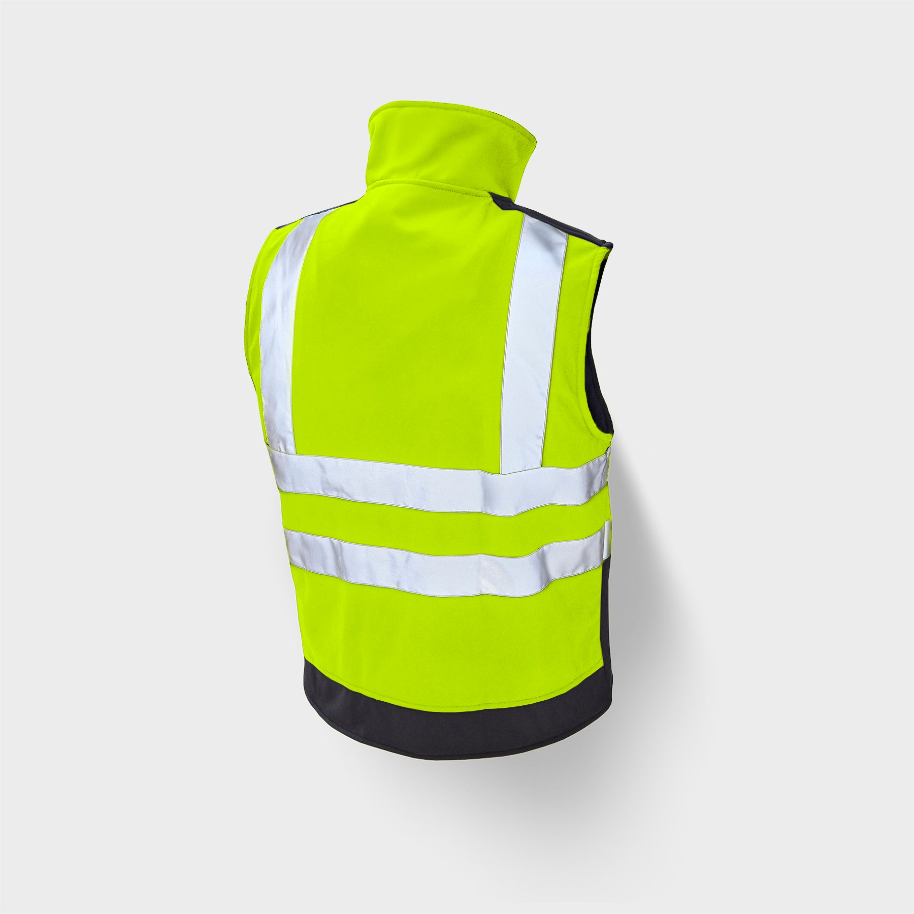 Yellow safety vest with reflective stripes on a light gray background